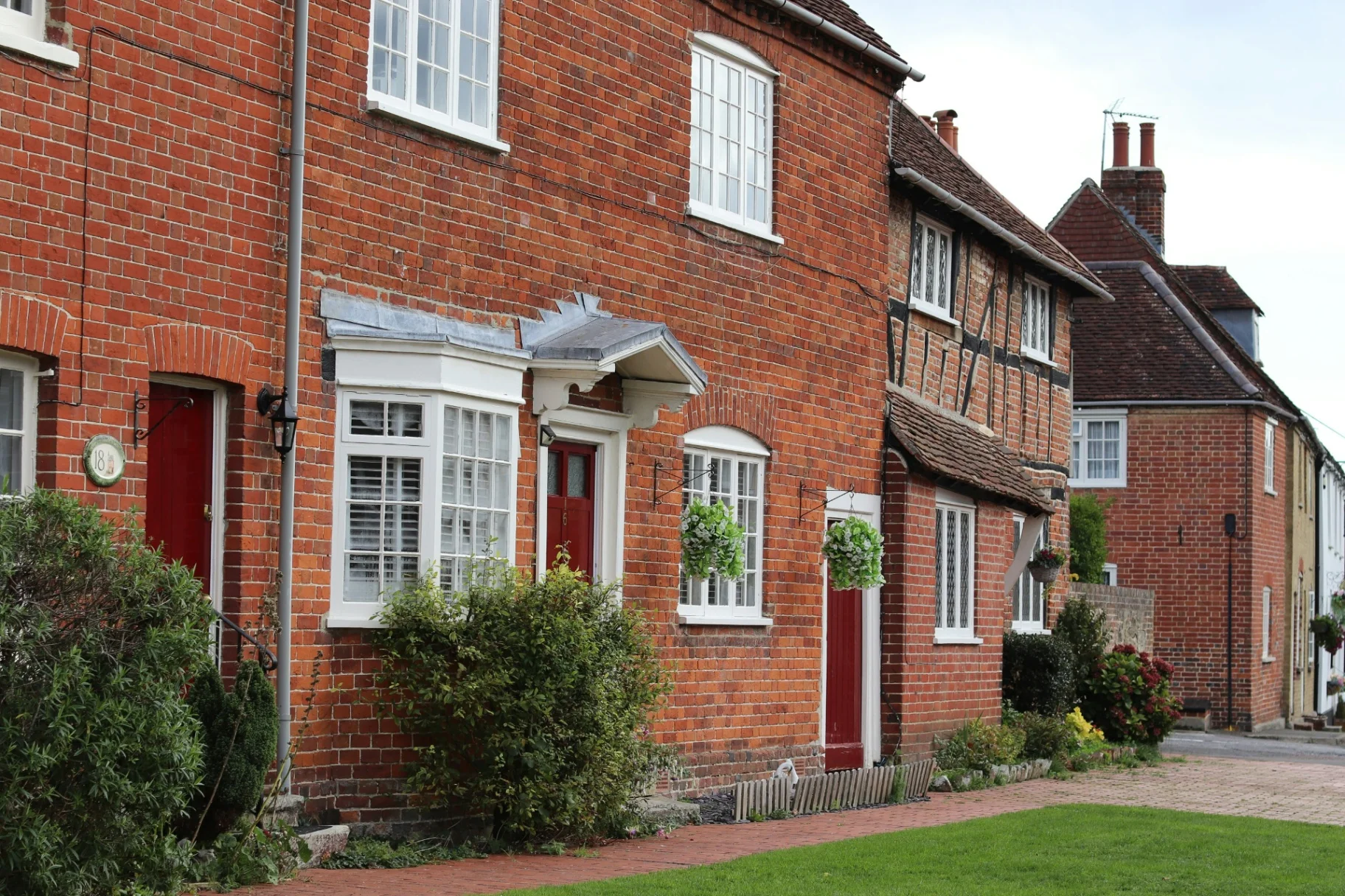 Traditional red brick terraced houses on a British street
